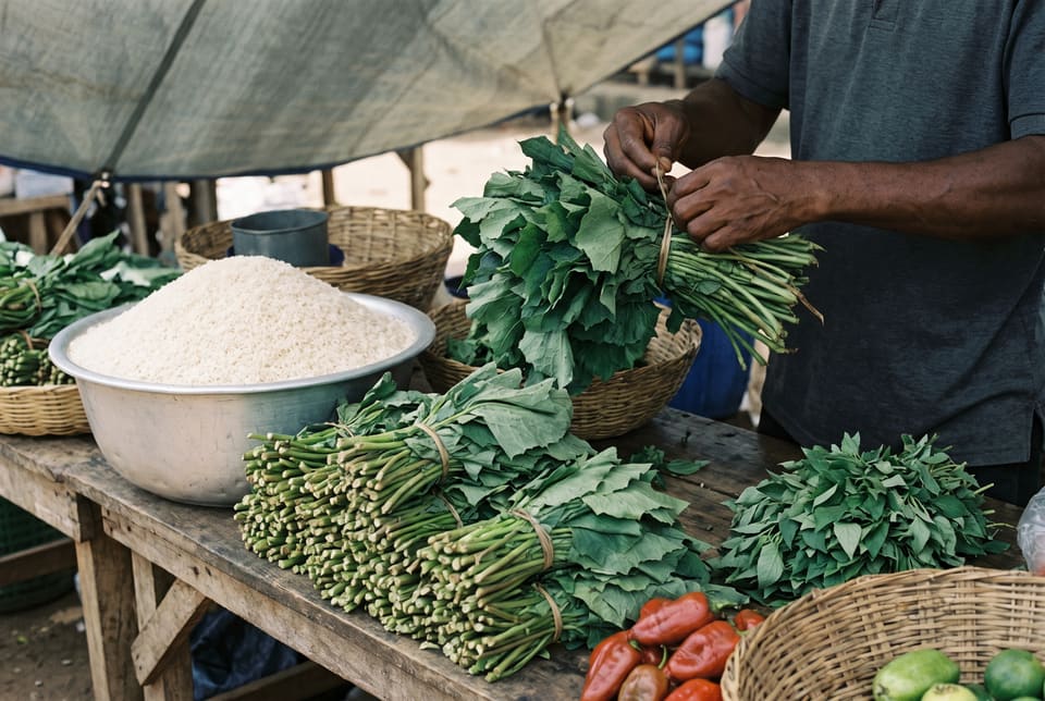 Ugu leaves, peppers and rice on a market stall in Wuse, Abuja